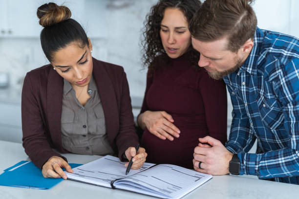 istock A young couple review their finances with a financial planner 1211231321