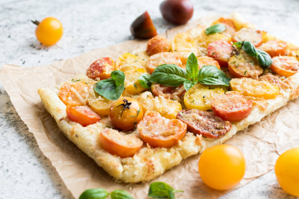 istock Vegetable puff pastry tart with colorful tomatoes 1211231874