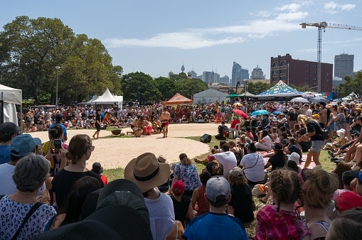 Sydney, Australia - January 26, 2020: People watching traditional Aboriginal corroboree performance at Yabun festival