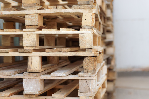 A range of wooden pallets. Inventory for shipment in the warehouse.