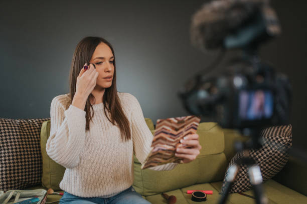 istock Beauty blogger is recording her new Vlog while doing make up. 1211237042