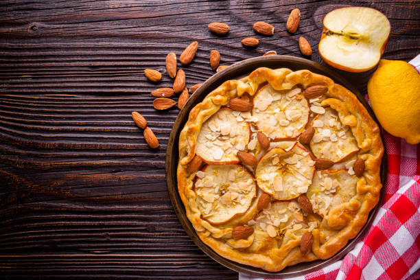 istock crispy apple galette with almonds on rustic wooden background 1211237090