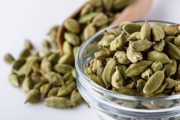 istock fragrant green cardamom on a white acrylic background 1211237829