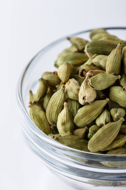 istock fragrant green cardamom on a white acrylic background 1211237979