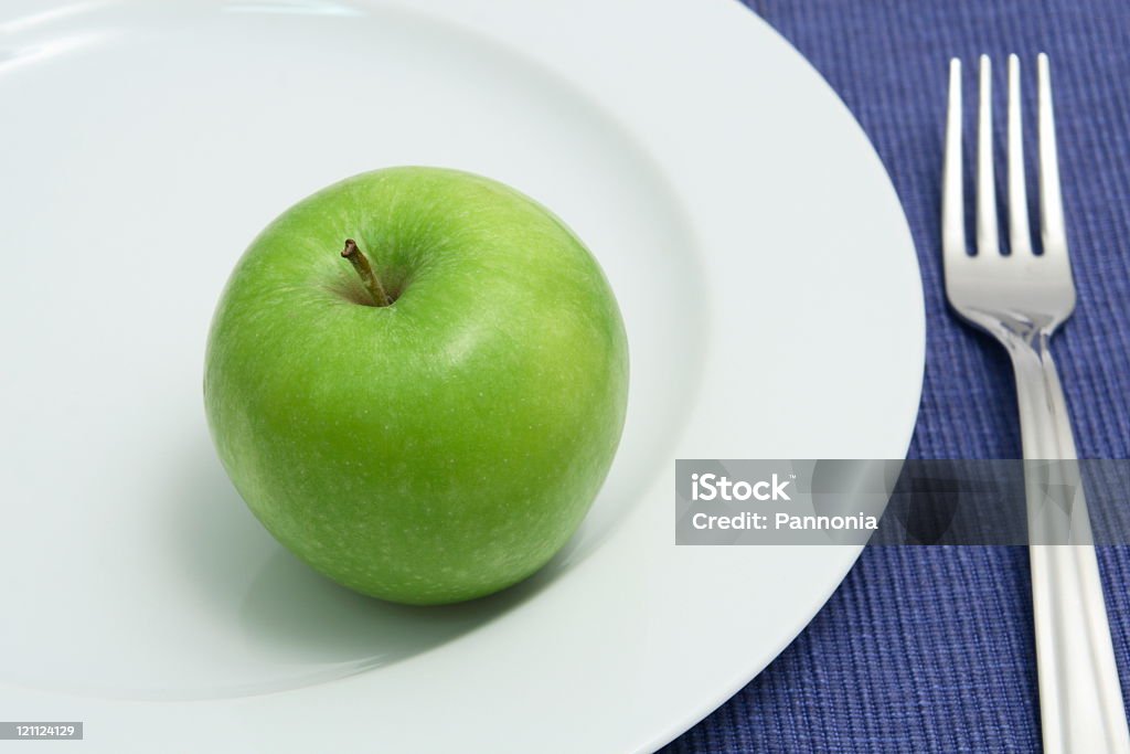 Apple on Plate Green apple on plate Apple - Fruit Stock Photo