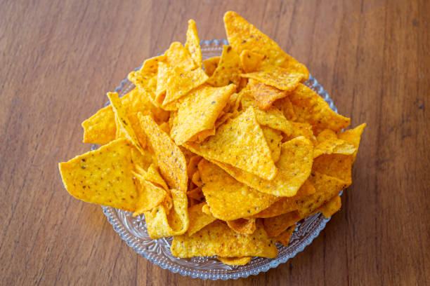 istock Delicious tortilla chips or nachos on wooden background made from selected corn 1211243365