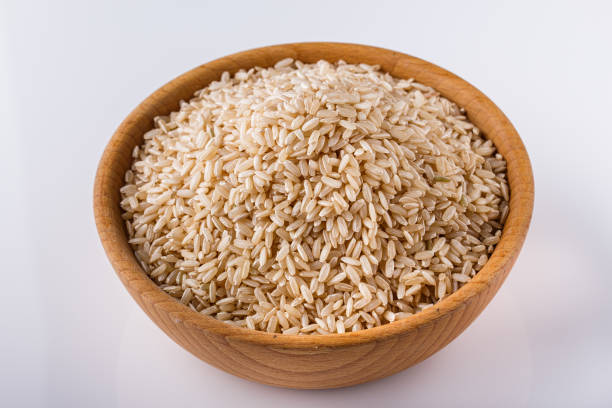 istock raw brown rice on white acrylic background 1211244748