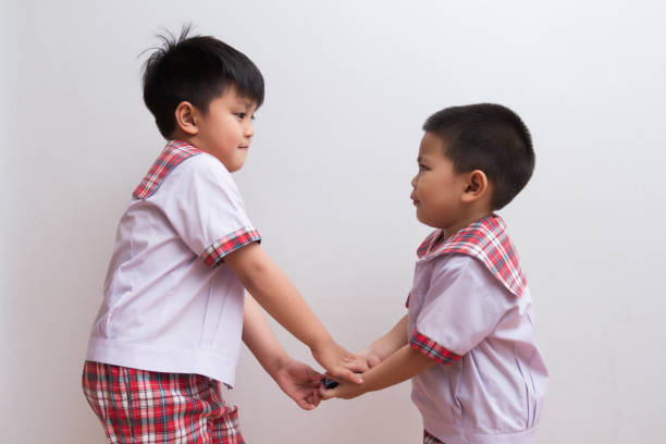 istock Big students are bullying smaller friends. 1211245825