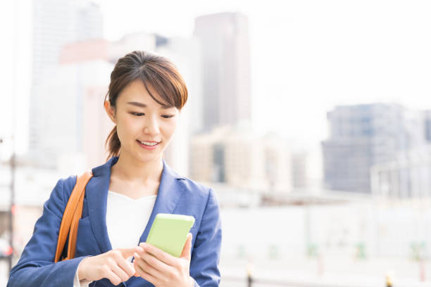asian woman who see a smart phone