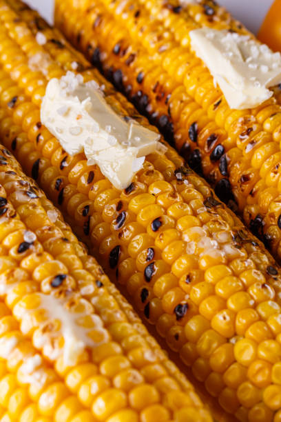 istock grilled corn cob on white wooden rustic background 1211248217