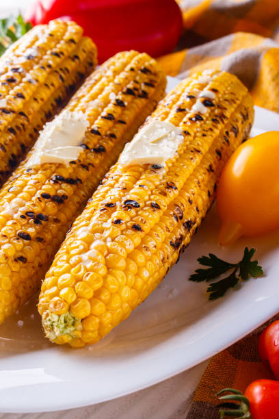 istock grilled corn cob on white wooden rustic background 1211248248