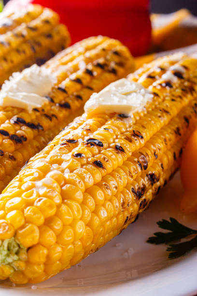 istock grilled corn cob on white wooden rustic background 1211248250
