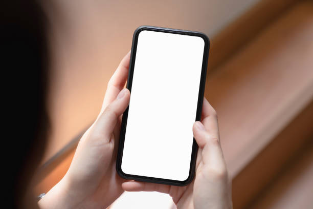 istock Hand holding blank screen of smartphone and for graphic display montage. 1211248293