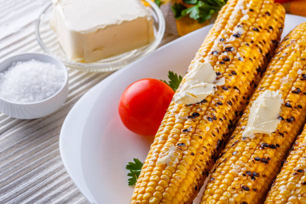 istock grilled corn cob on white wooden rustic background 1211248432