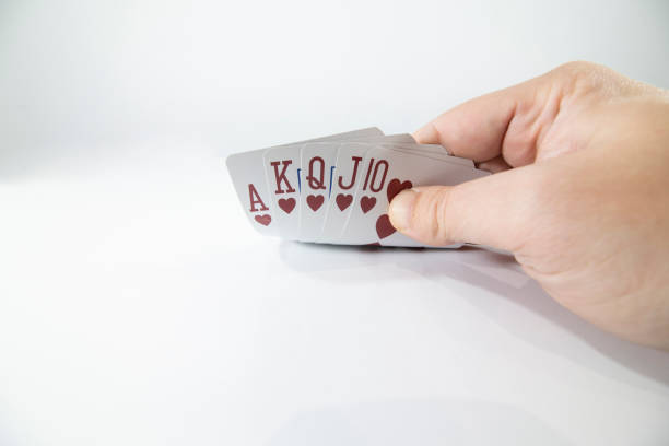 Closeup of checking playing cards isolated on white stock photo