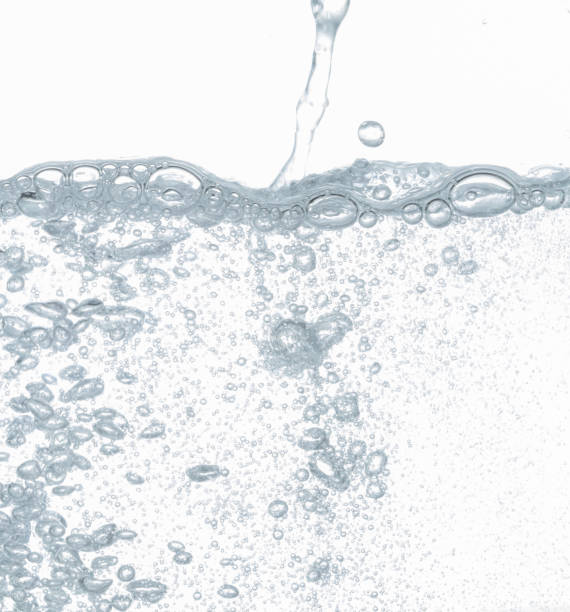 istock Close up water bubbles underwater on white background. 1211255759