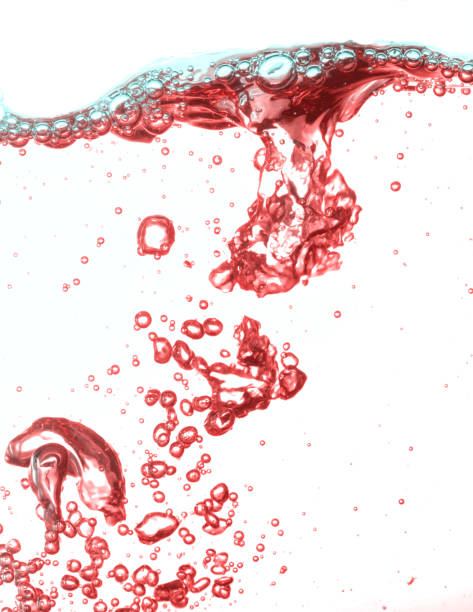 istock Close up water bubbles underwater on white background.Red bubbles on white. 1211255772