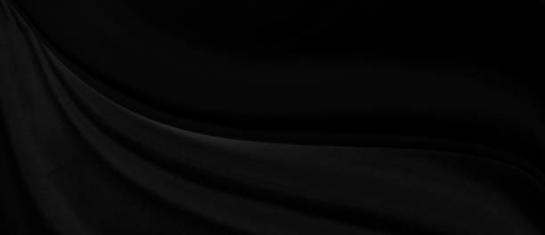 istock Black gray satin dark fabric texture luxurious shiny that is abstract silk cloth panorama background with patterns soft waves blur beautiful. 1211255968