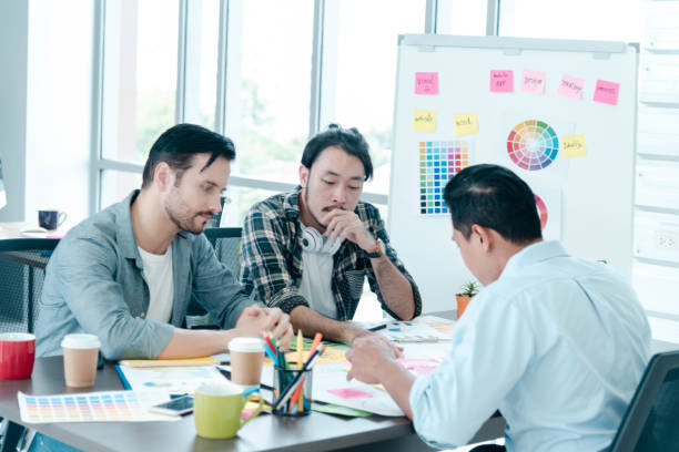istock Diversity Creative Design Collaboration Team Meeting Communication with Business Partners Teamwork Working Together in Conference Room. Group of young people Meeting Trust in Businessman and Team. 1211256618