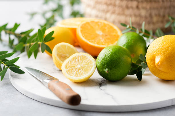 istock Fresh citrus fruits on marble board 1211258597