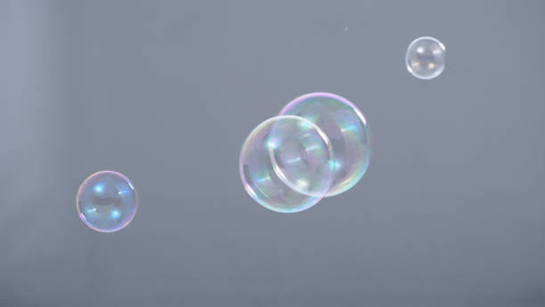istock Soap or shampoo bubbles floating in the air by wind blow which represent refreshing and relaxing or joyful mood and tone and shoot in clear background in studio lighting set. 1211264508