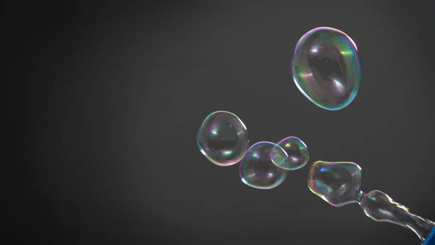 istock Soap or shampoo bubbles floating in the air by wind blow which represent refreshing and relaxing or joyful mood and tone and shoot in clear background in studio lighting set. 1211264519