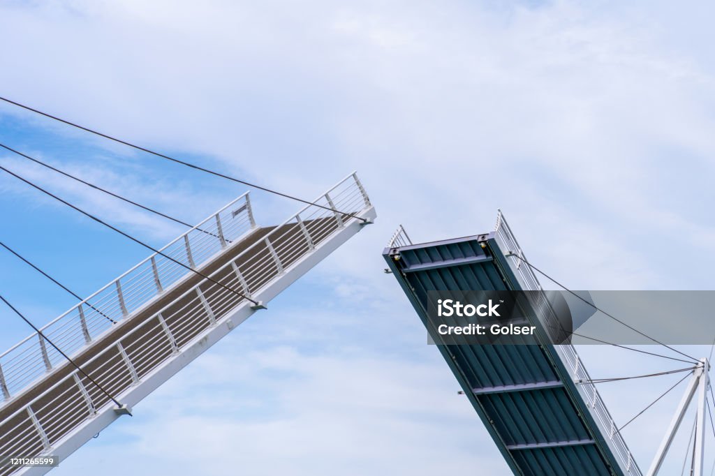 Auckland, New Zealand, February 5, 2020: Wynyard Crossing.The 100m long bridge is able to lift to allow vessels to pass through the viaduct harbor area, raising two 22m moving sections. Drawbridge Stock Photo