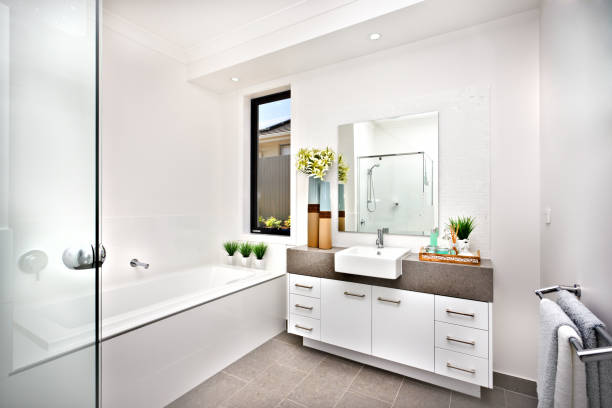 Plenty of cabinets for storage of linens and toiletries in showcase bathroom suite