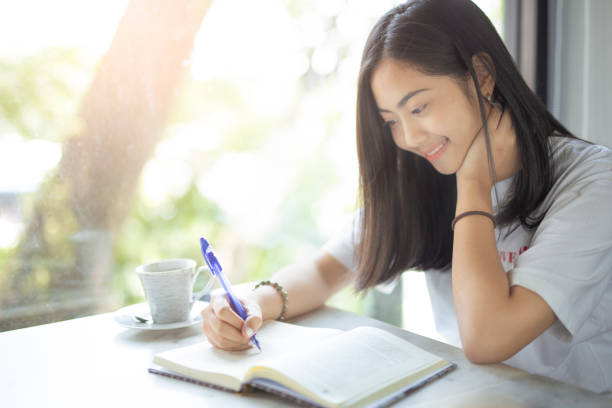 istock Woman relaxed reading a book  at coffee shop 1211266801