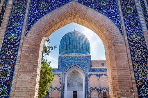 Traditional Uzbek pattern on the ceramic tile on the wall of the madrasah. Banner. Registan, Samarkand, Uzbekistan