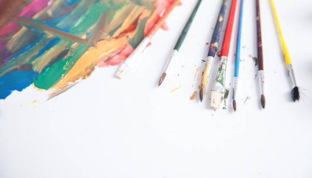 istock Watercolor brushes on white paper. Art 1211269526