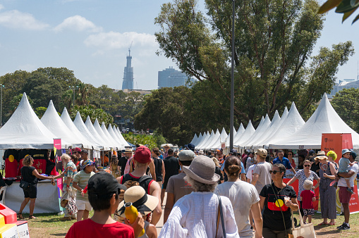 Sydney, Australia - January 26, 2020: Crowd of people at marketplace at Yabun aboriginal festival in Victoria Park in Redfern suburb of Sydney, Australia