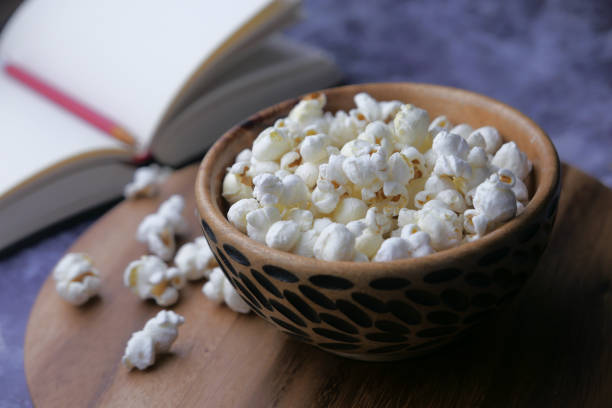 istock Close up of popcorn in a bowl on table 1211270529