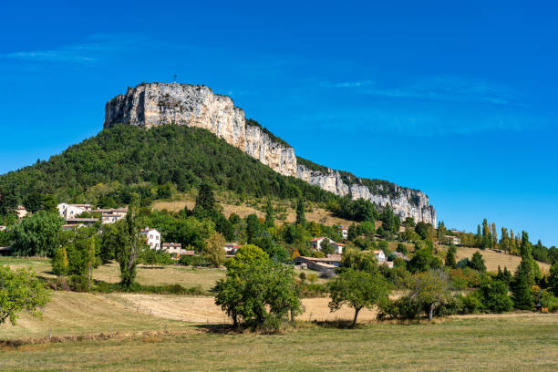 Plain de Baix with Vellan rock in Vercors, French Alps, France Plain de Baix with Vellan rock, plateau du Vellan in Vercors, French Alps, France drome stock pictures, royalty-free photos & images