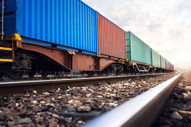 Train wagons carrying cargo containers for shipping companies. Distribution and transportation using railroads. rail transportation stock pictures, royalty-free photos & images