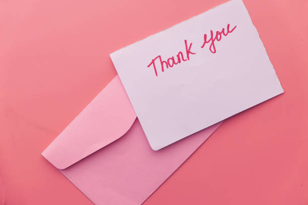 istock thank you letter and envelope on pink background 1211276277