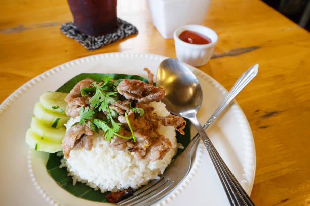 istock Rice topped with stir-fried pork and basil 1211277229