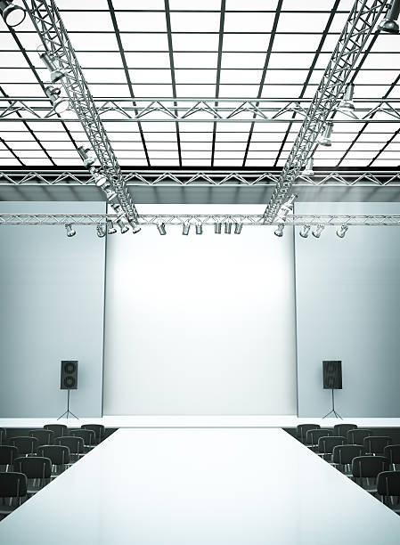 Fashion catwalk stage with lighting and seats Empty fashion show stage with runway. 3D rendered image. catwalk stage stock pictures, royalty-free photos & images