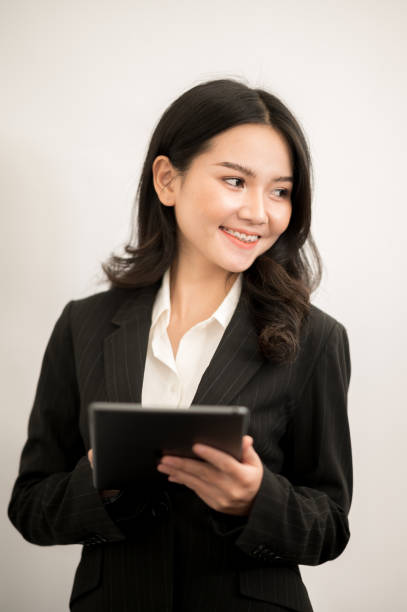 istock Asian working women wear black suits on isolated background 1211278877