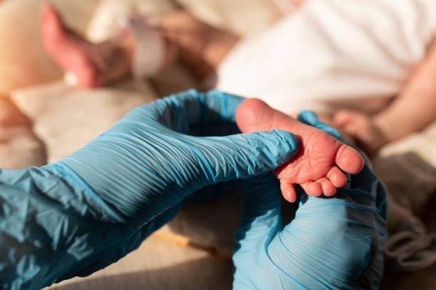 istock A baby's foot in mother hands 1211279622