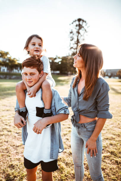 istock happy family have fun in the park 1211279656