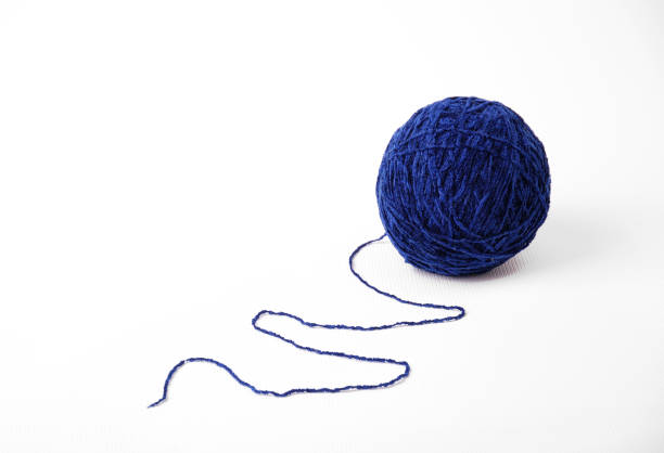 istock Clue of yarn with tail isolated on white 121127968