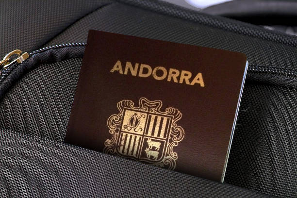 Close up of Andorra Passport in Black Suitcase Pocket Photo of a single suitcase made of fabric material and one passport in pocket. andorra photos stock pictures, royalty-free photos & images