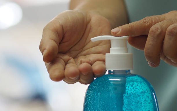 Woman push pump bottle use a hand wash gel to prevent germs protect virus covid 19 Woman push pump bottle use a hand wash gel to prevent germs protect virus covid 19 antiseptic stock pictures, royalty-free photos & images