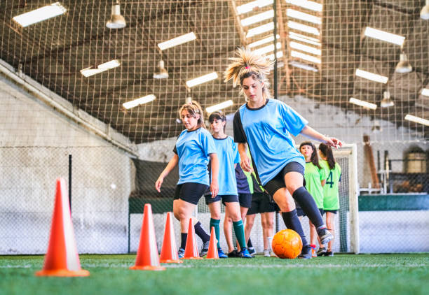 istock Soccer girl practicing skills at court 1211280187