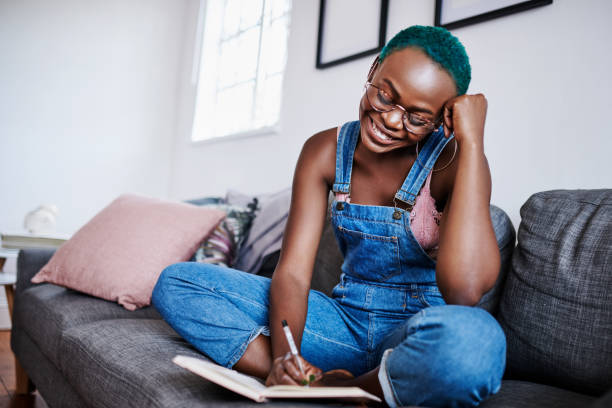 istock She's always reading a lot and writing just as much 1211281044