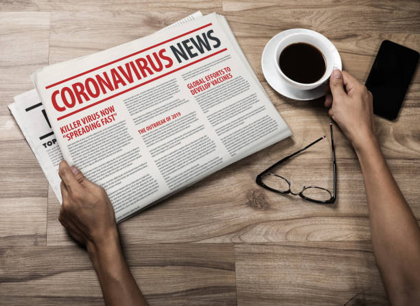 mockup of coronavirus newspaper, news related of the covid-19 with the the headline in paper media press production concept in businessman hands - newspaper the media paper newspaper headline imagens e fotografias de stock