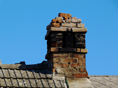 Smoke stacks on the top of the buildings