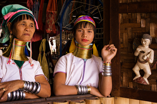 INLE LAKE, MYANMAR - May 19, 2019: Portrait of two Kayan Lahwi tribe women with neck rings. Long neck woman.