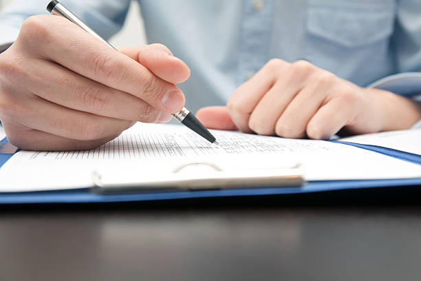 istock Businessman doing some paperwork in his office 121128272